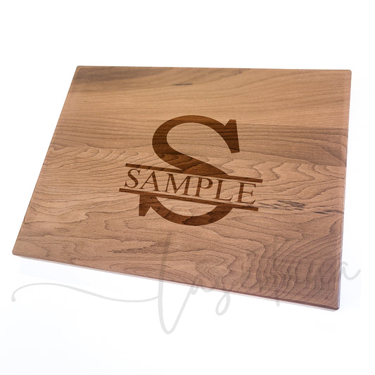 Thermal Maple Hardwood cutting board with a Sample monogram on a white background