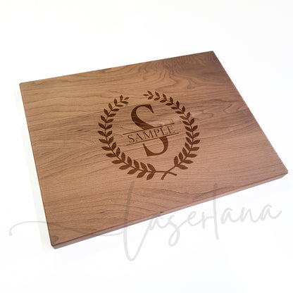 Thermal Maple Cutting Board Sample with Olive Branch Style leaves surrounding a large S and the word Sample - Lasertana faintly watermarked